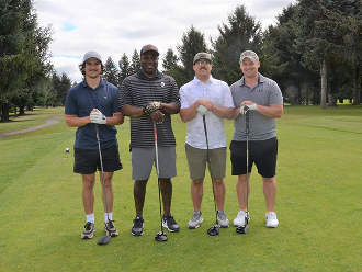 Four golfers on course